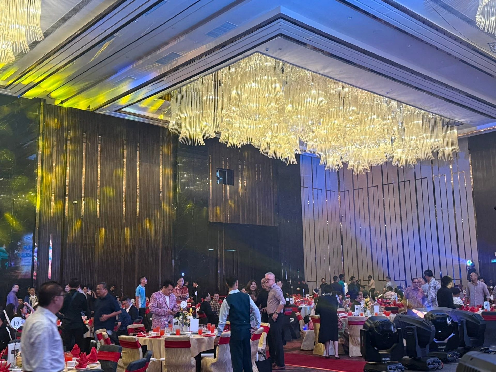 Wedding banquet in a ballroom with crystal chandeliers